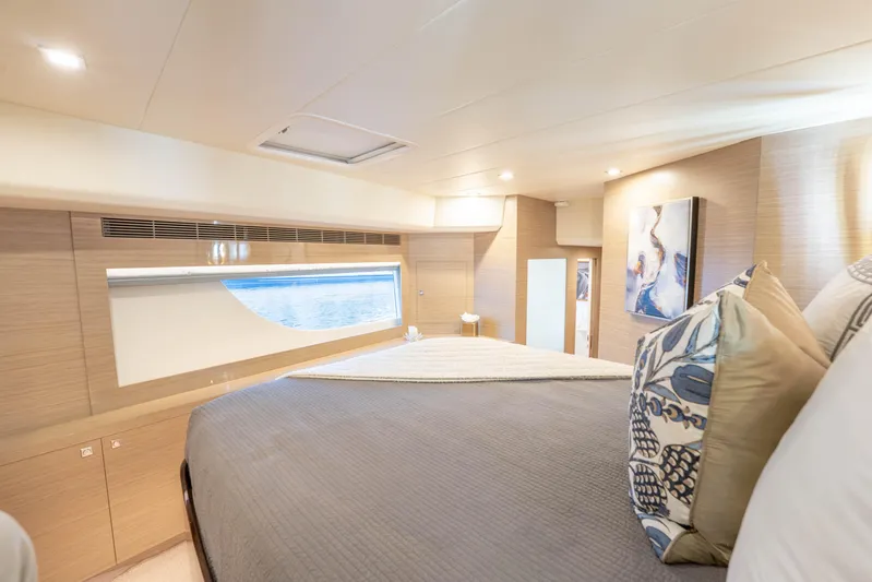 Homarus Yacht Photos Pics Luxurious 2021 Horizon yacht bedroom with elegant decor and ocean view window.