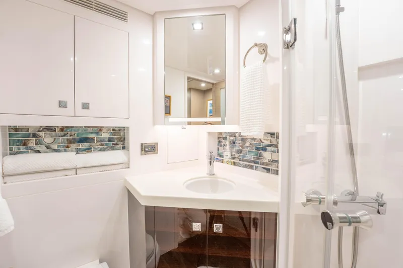 Homarus Yacht Photos Pics Modern yacht bathroom with sleek fixtures, mosaic backsplash, and elegant lighting, Horizon 2021.