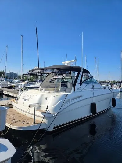 2 Spicy Yacht Photos Pics 2003 Sea Ray 380 Sundancer yacht docked at marina under clear blue sky.