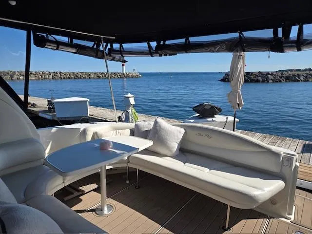 2 Spicy Yacht Photos Pics 2003 Sea Ray 380 Sundancer yacht interior with seating, table, and ocean view.