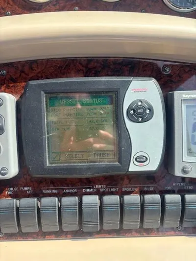 2 Spicy Yacht Photos Pics Control panel of a 2003 Sea Ray 380 Sundancer boat with navigation and system displays.