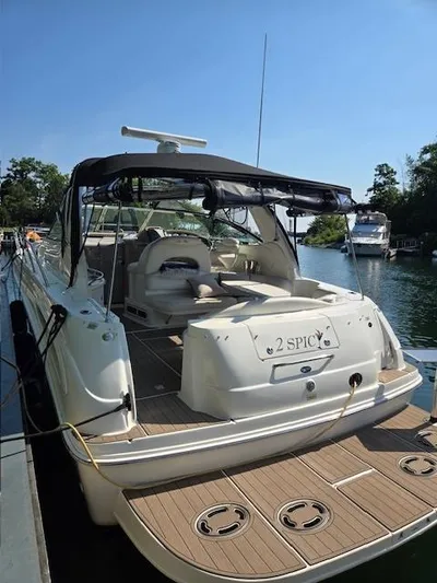 2 Spicy Yacht Photos Pics 2003 Sea Ray 380 Sundancer yacht docked, featuring spacious deck and canopy.