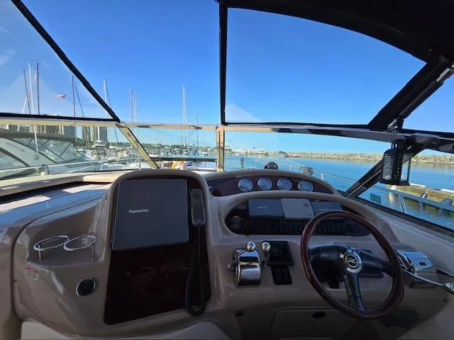 2 Spicy Yacht Photos Pics Helm of 2003 Sea Ray 380 Sundancer yacht with marina view.