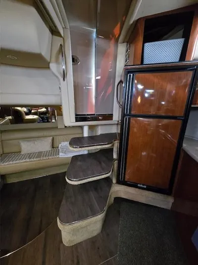 2 Spicy Yacht Photos Pics Interior of 2003 Sea Ray 380 Sundancer with wooden steps and cabinetry.