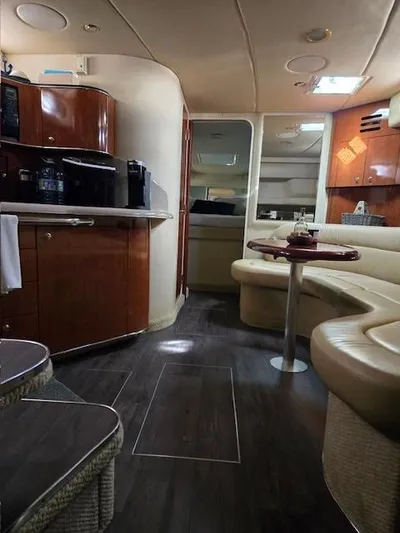 2 Spicy Yacht Photos Pics Interior of 2003 Sea Ray 380 Sundancer yacht with elegant wood cabinetry and plush seating.