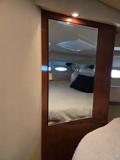 2 Spicy Yacht Photos Pics Interior of 2003 Sea Ray 380 Sundancer yacht with mirrored door and cozy bed.