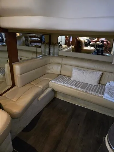 2 Spicy Yacht Photos Pics Luxurious interior of a 2003 Sea Ray 380 Sundancer yacht with beige leather seating.