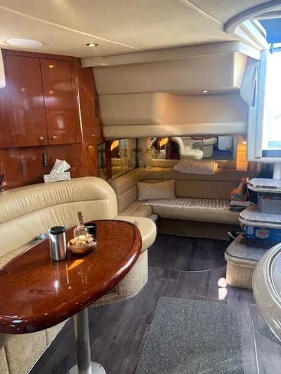 2 Spicy Yacht Photos Pics Interior of 2003 Sea Ray 380 Sundancer yacht with elegant seating and wooden finishes.