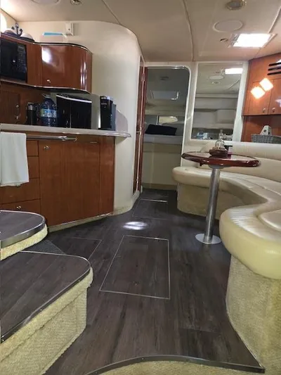2 Spicy Yacht Photos Pics Interior of 2003 Sea Ray 380 Sundancer yacht with kitchen and seating area.
