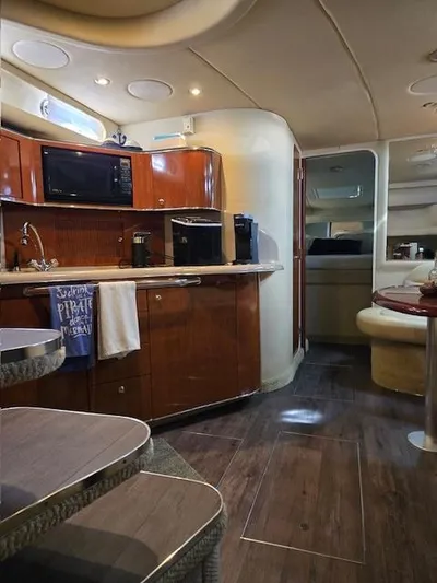 2 Spicy Yacht Photos Pics Interior of 2003 Sea Ray 380 Sundancer yacht with kitchen and seating area.