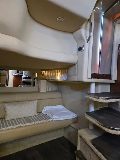 2 Spicy Yacht Photos Pics Interior of 2003 Sea Ray 380 Sundancer yacht, featuring cozy seating and elegant design.