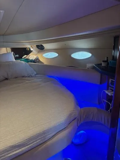 2 Spicy Yacht Photos Pics Cozy cabin interior of 2003 Sea Ray 380 Sundancer with ambient blue lighting.