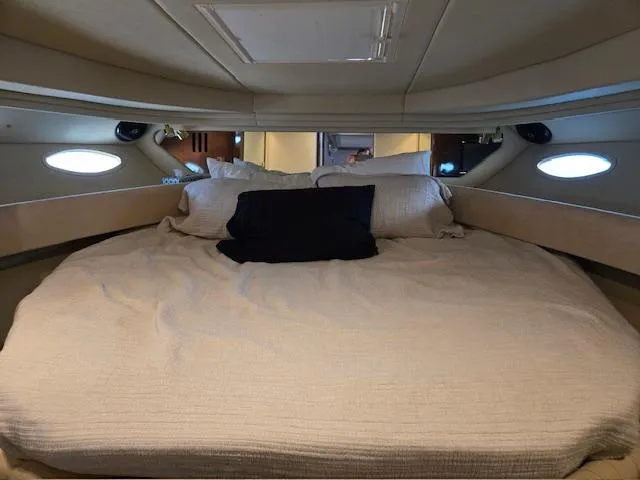 2 Spicy Yacht Photos Pics Cozy cabin interior of 2003 Sea Ray 380 Sundancer with comfortable bedding.