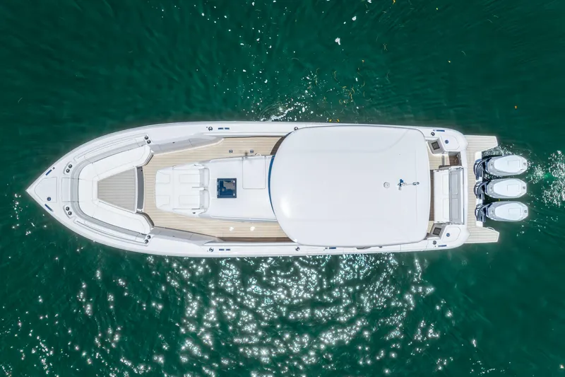  Yacht Photos Pics Aerial view of 2025 Intrepid 41 Panacea yacht on clear blue water.