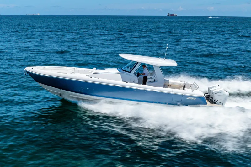  Yacht Photos Pics 2025 Intrepid 41 Panacea cruising swiftly on open ocean waters.