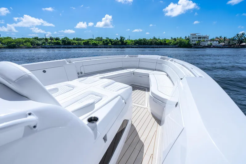  Yacht Photos Pics 2025 Intrepid 41 Panacea boat with spacious seating on a sunny day.