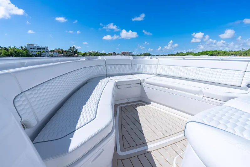  Yacht Photos Pics Luxurious seating on 2025 Intrepid 41 Panacea boat under clear blue sky.