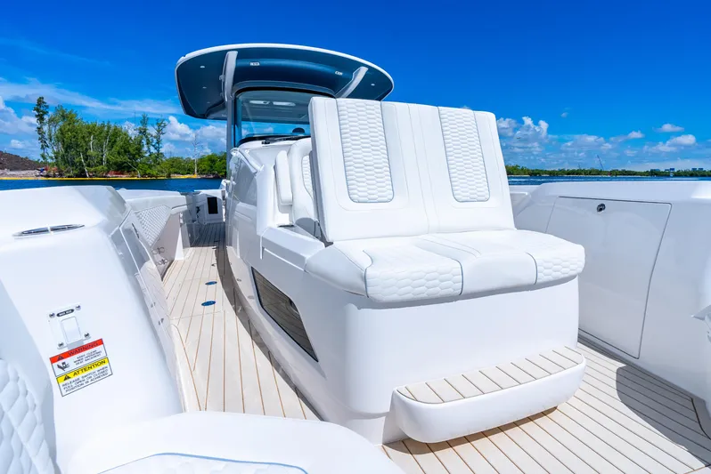  Yacht Photos Pics 2025 Intrepid 41 Panacea luxury boat with white seating and sleek design.