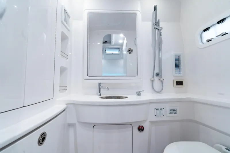  Yacht Photos Pics Luxurious bathroom in 2025 Intrepid 41 Panacea yacht, featuring modern fixtures and sleek design.