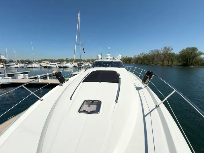  Yacht Photos Pics 2003 Sea Ray 680 Sun Sport yacht docked at marina under clear blue sky.