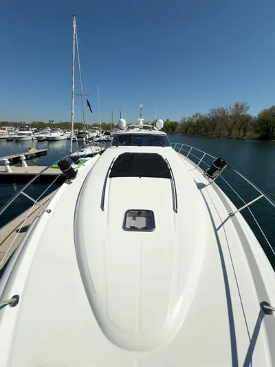  Yacht Photos Pics 2003 Sea Ray 680 Sun Sport yacht docked at marina under clear blue sky.