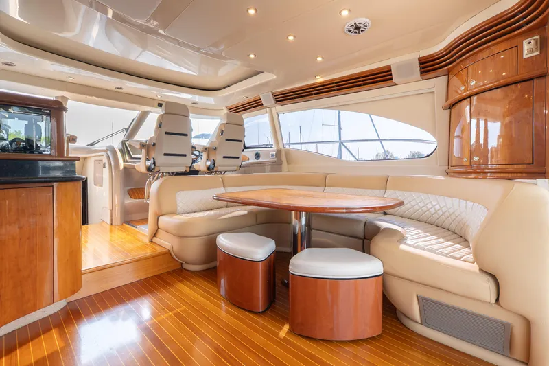  Yacht Photos Pics Luxurious interior of 2003 Sea Ray 680 Sun Sport yacht with elegant seating and wood finishes.