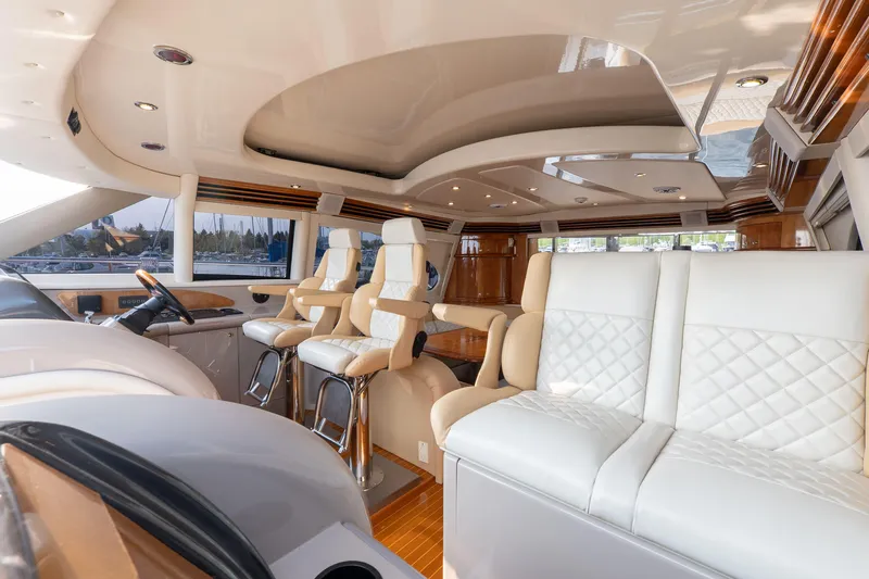  Yacht Photos Pics Luxurious interior of 2003 Sea Ray 680 Sun Sport yacht with elegant seating and modern design.