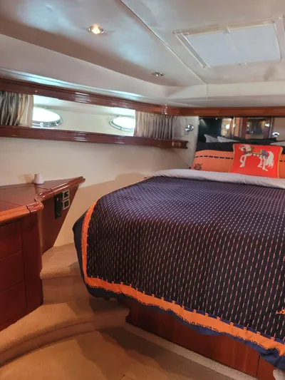  Yacht Photos Pics Luxurious cabin interior of 2003 Sea Ray 680 Sun Sport yacht with cozy bedding.