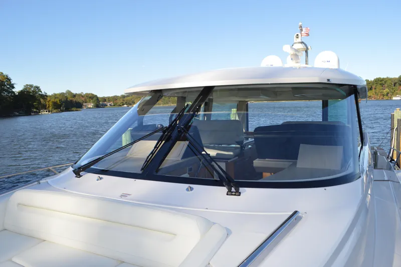 Jack's Boat Yacht Photos Pics 2024 Tiara Yachts EX 60 on serene water, showcasing sleek design and modern features.