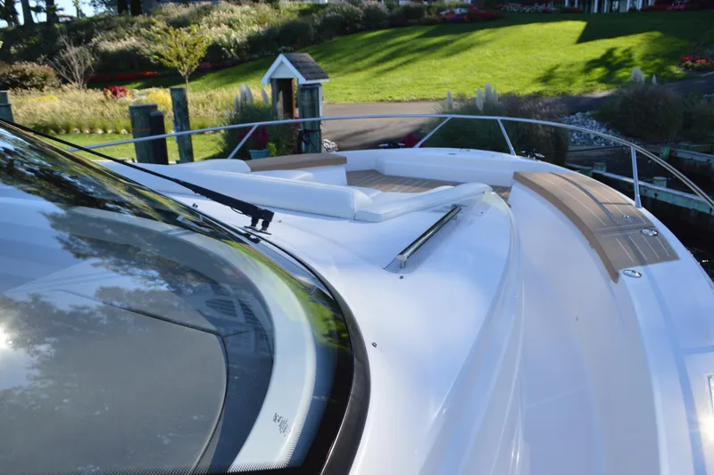 Jack's Boat Yacht Photos Pics 2024 Tiara Yachts EX 60 deck with sleek design and scenic background.