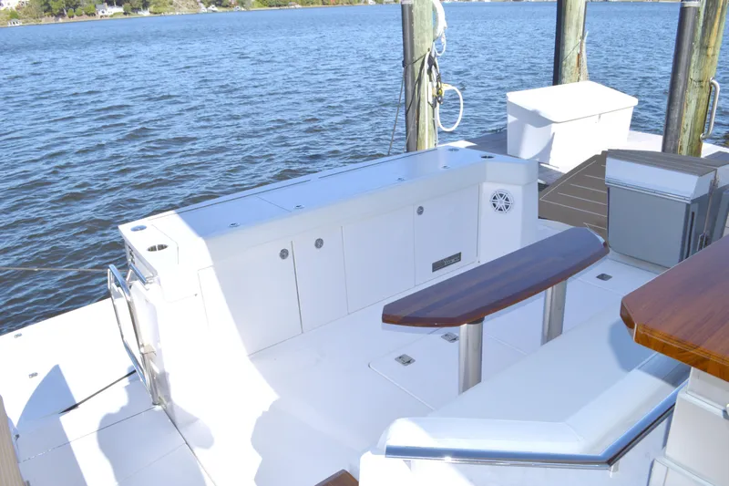 Jack's Boat Yacht Photos Pics 2024 Tiara Yachts EX 60 deck with seating and water view.