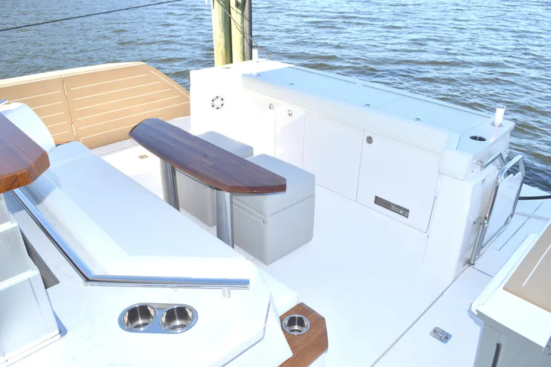 Jack's Boat Yacht Photos Pics 2024 Tiara Yachts EX 60 deck with seating and ocean view.