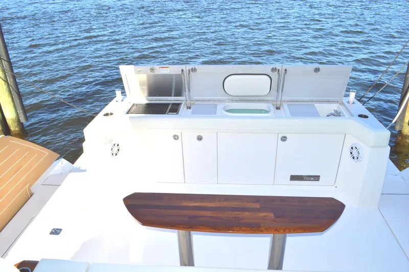 Jack's Boat Yacht Photos Pics 2024 Tiara Yachts EX 60 outdoor kitchen with grill and sink by the water.