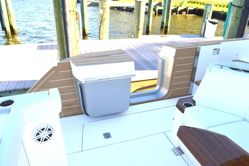 Jack's Boat Yacht Photos Pics 2024 Tiara Yachts EX 60 deck with seating and dock view.