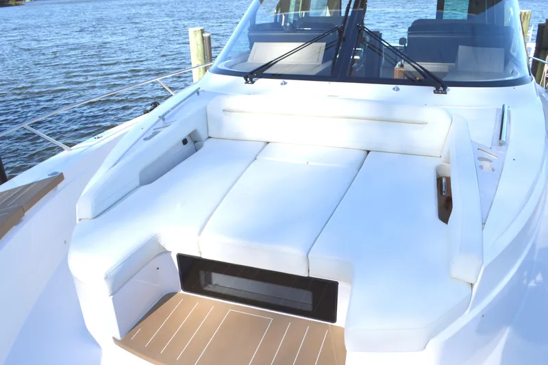 Jack's Boat Yacht Photos Pics 2024 Tiara Yachts EX 60 deck with luxurious seating by the water.