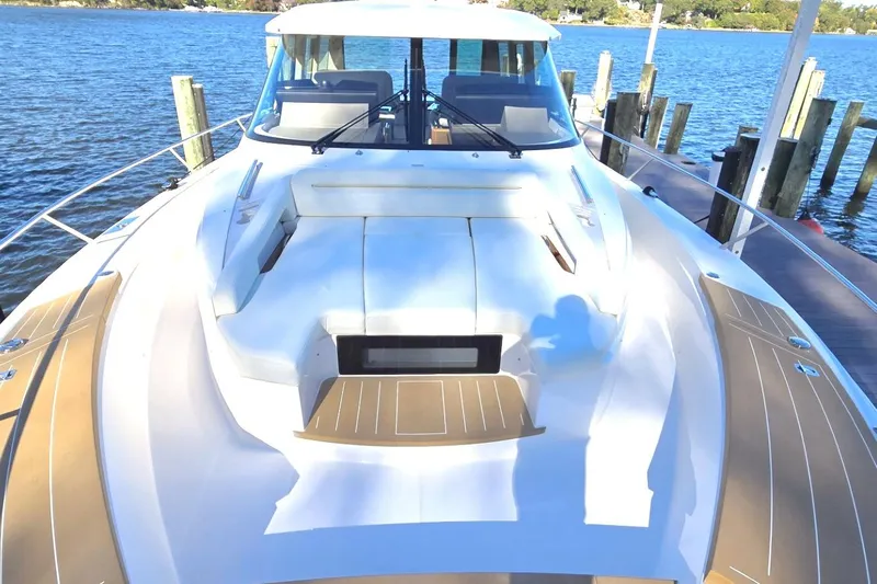 Jack's Boat Yacht Photos Pics 2024 Tiara Yachts EX 60 luxury yacht docked by the water.