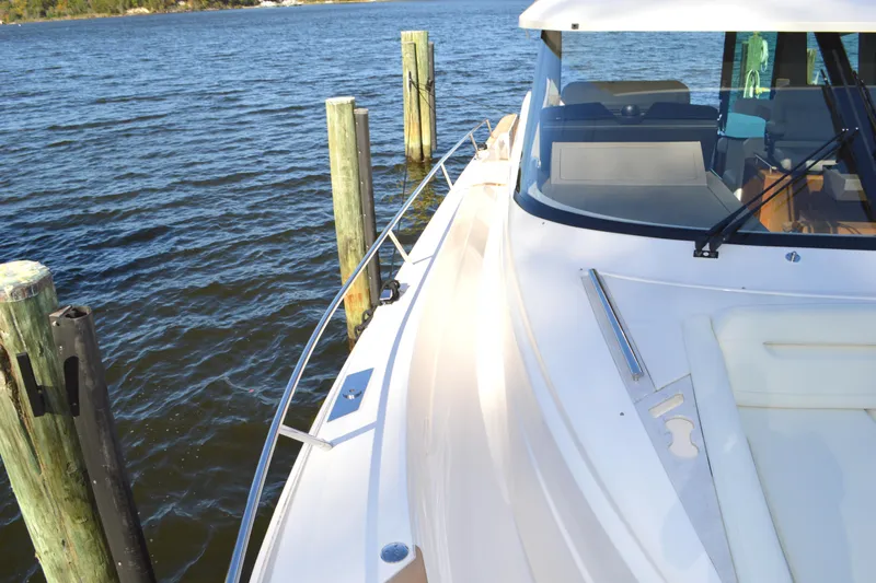 Jack's Boat Yacht Photos Pics 2024 Tiara Yachts EX 60 docked, showcasing sleek design and luxurious deck features.