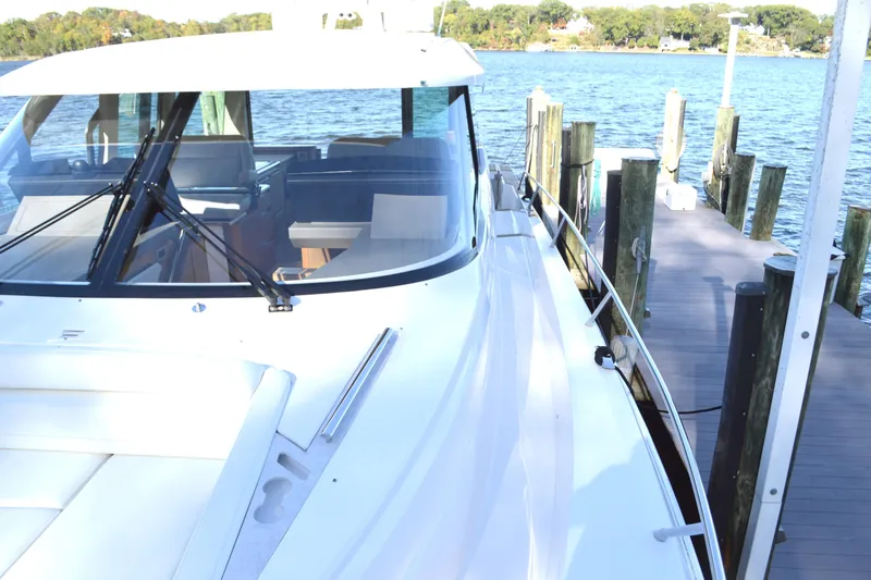 Jack's Boat Yacht Photos Pics 2024 Tiara Yachts EX 60 docked, showcasing sleek design and luxurious features.