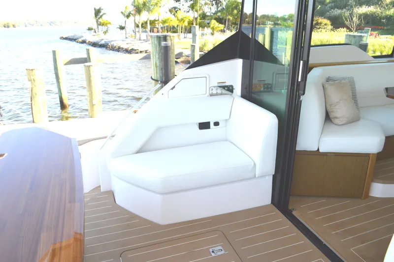 Jack's Boat Yacht Photos Pics Luxurious seating area on 2024 Tiara Yachts EX 60, featuring elegant design and waterfront view.