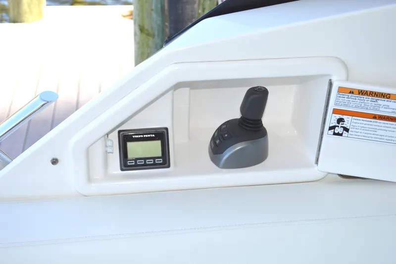 Jack's Boat Yacht Photos Pics Control panel of 2024 Tiara Yachts EX 60 with joystick and Volvo Penta display.