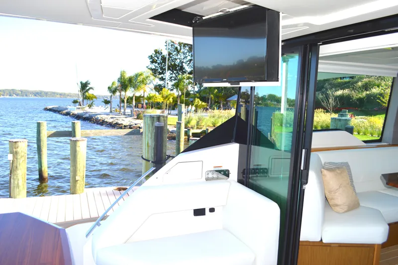 Jack's Boat Yacht Photos Pics 2024 Tiara Yachts EX 60 interior with waterfront view and modern amenities.