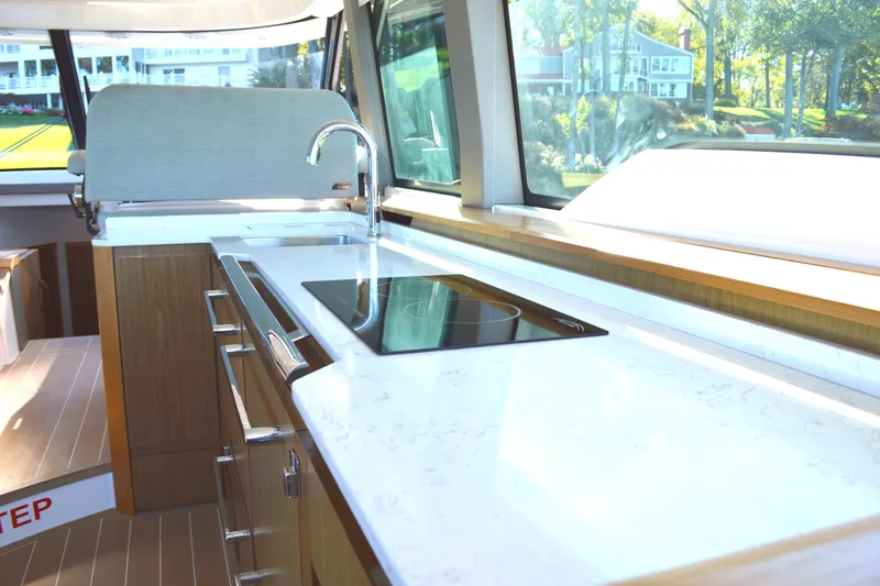 Jack's Boat Yacht Photos Pics Luxurious kitchen interior of 2024 Tiara Yachts EX 60 with sleek countertops and modern appliances.