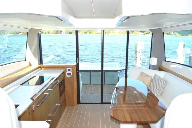 Jack's Boat Yacht Photos Pics Luxurious interior of 2024 Tiara Yachts EX 60 with elegant wood finishes and lake view.