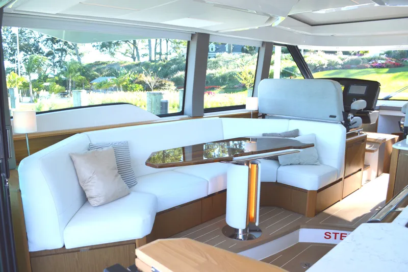 Jack's Boat Yacht Photos Pics Luxurious interior of 2024 Tiara Yachts EX 60 with elegant seating and modern design.