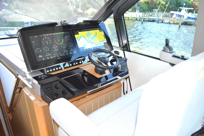 Jack's Boat Yacht Photos Pics 2024 Tiara Yachts EX 60 helm with advanced navigation displays and steering wheel.