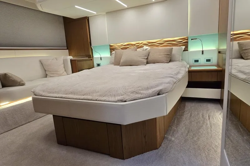 Jack's Boat Yacht Photos Pics Luxurious 2024 Tiara Yachts EX 60 bedroom with modern design and elegant lighting.