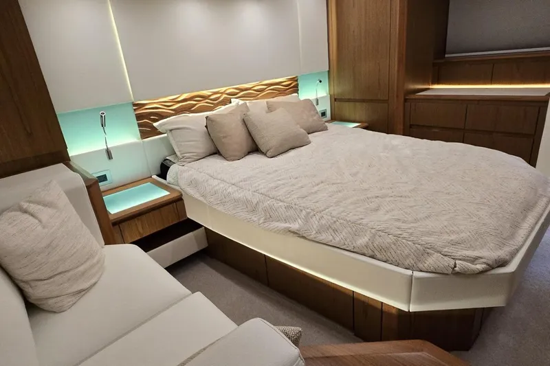 Jack's Boat Yacht Photos Pics Luxurious bedroom interior of 2024 Tiara Yachts EX 60 with modern design and ambient lighting.