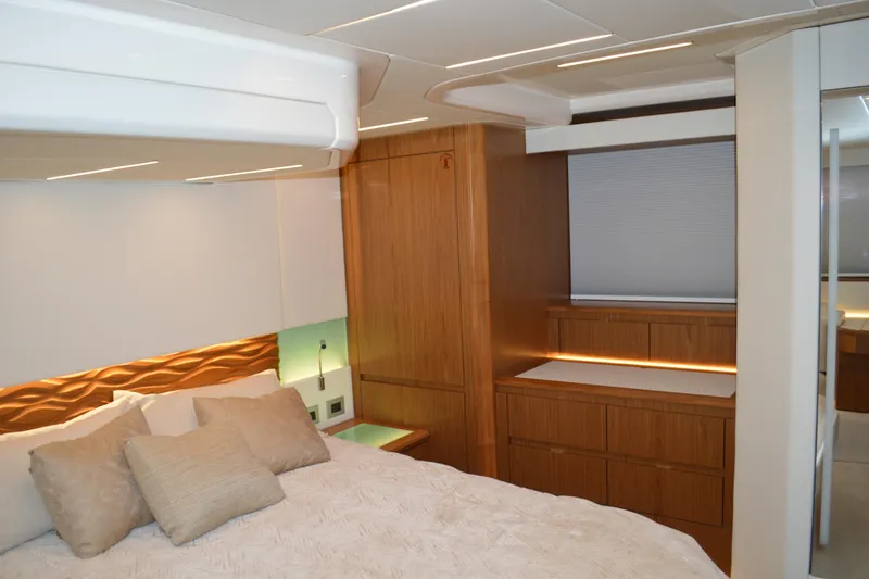 Jack's Boat Yacht Photos Pics Luxurious bedroom interior of 2024 Tiara Yachts EX 60 with modern wood finishes.