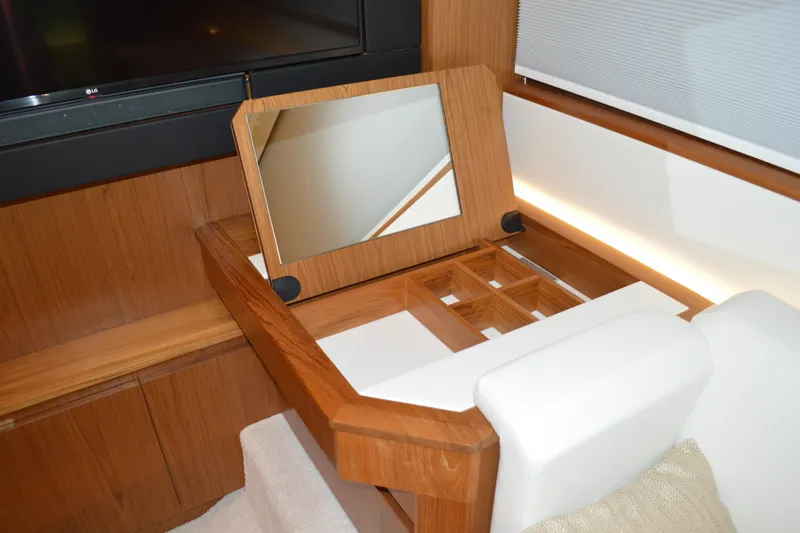 Jack's Boat Yacht Photos Pics 2024 Tiara Yachts EX 60 interior with wooden vanity and mirror.