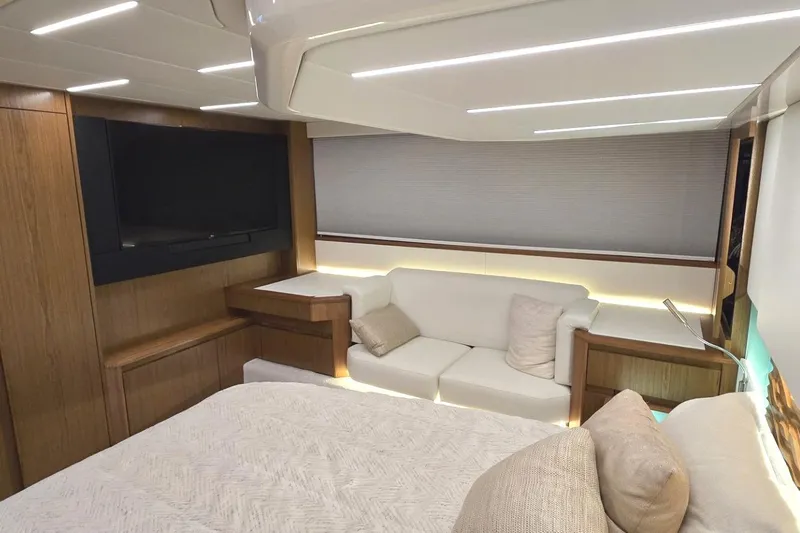 Jack's Boat Yacht Photos Pics Luxurious interior of 2024 Tiara Yachts EX 60 with modern furnishings and ambient lighting.